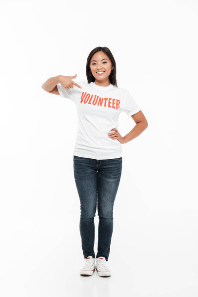 Portrait of a smiling young asian woman in volunteer t-shirt - Photo, Image