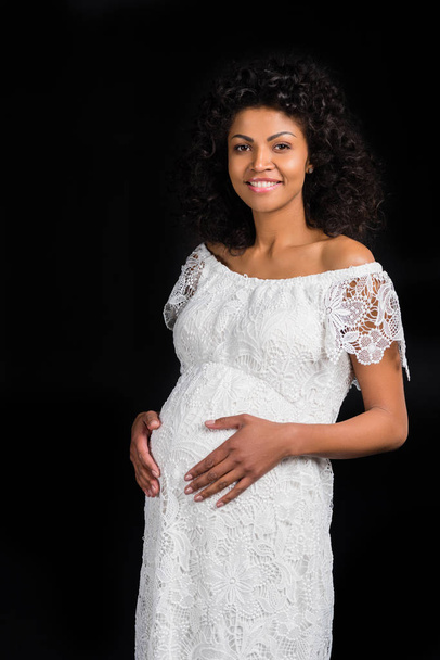 Těhotná žena dotýkající se břicha    - Fotografie, Obrázek