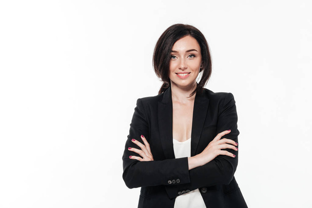 Portrait of a beautiful smiling businesswoman in a suit posing - Fotó, kép