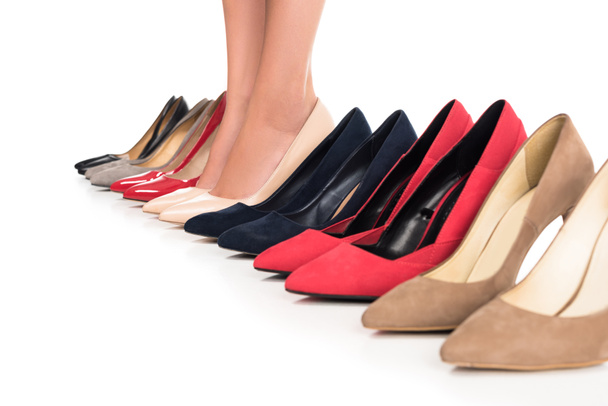 woman and arranged fashionable shoes - Photo, Image