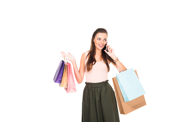mulher com sacos de compras falando no smartphone
 - Foto, Imagem