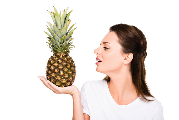 woman with fresh pineapple - Photo, Image