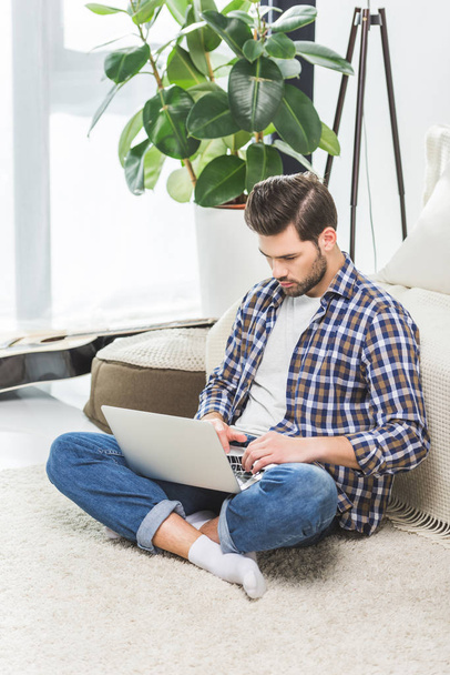 man using laptop at home - Photo, image
