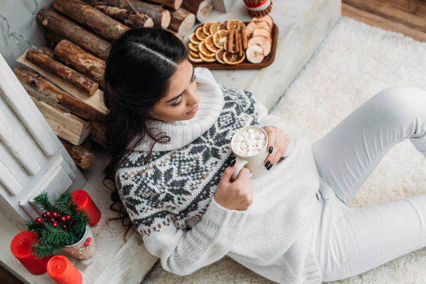 woman with cup of cocoa with marshmallow on christmas - Photo, Image
