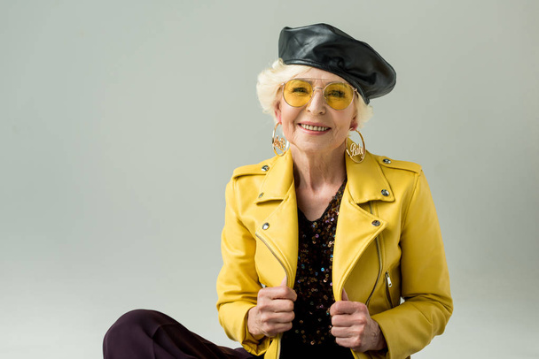 senior woman in yellow jacket and beret - Zdjęcie, obraz