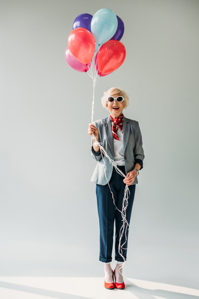 senior lady with balloons - Foto, Imagen