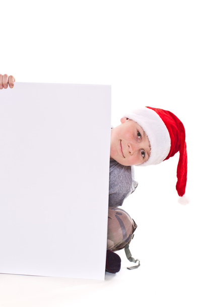 boy in the Christmas hat with a blank - 写真・画像
