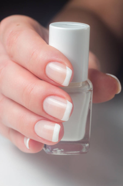 Manicure. French manicure. Nail polish. Paint your nails. - Фото, изображение