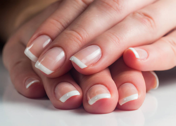 Manicure. French manicure. Nail polish. Paint your nails. - Foto, Bild