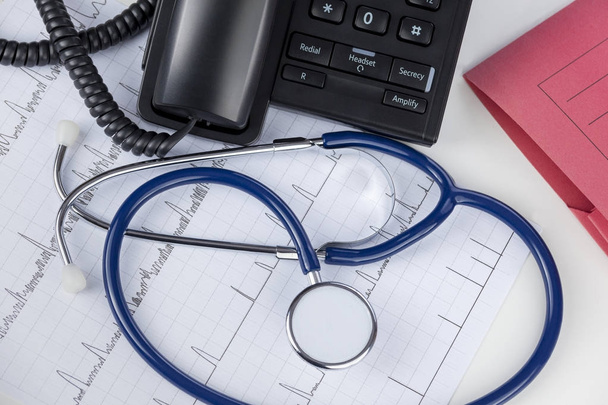 Stethoscope and telephone on a doctors desk - Photo, Image