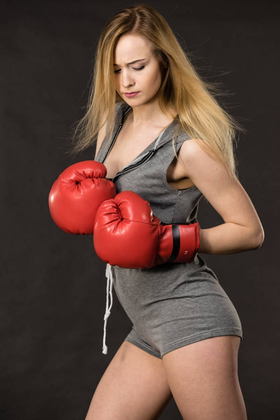Beautiful woman with red boxing gloves - 写真・画像