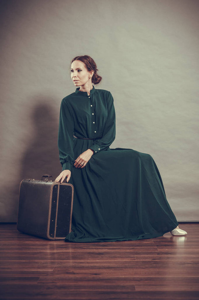 Woman retro style with old suitcase - Фото, изображение
