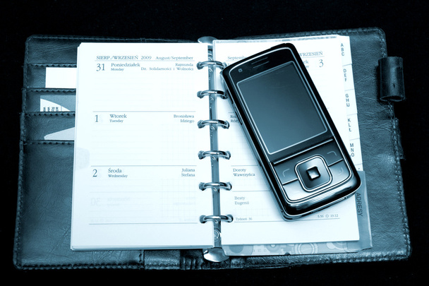 Cuaderno y teléfono
 - Foto, imagen