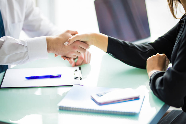 Business handshake at meeting or negotiation in the office. Partners are satisfied because signing contract or financial papers. Business. - Fotó, kép