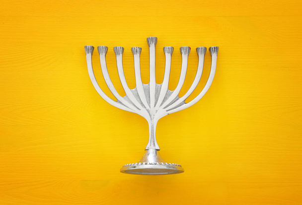 jewish holiday Hanukkah image background with traditional menorah (traditional candelabra) - Fotoğraf, Görsel