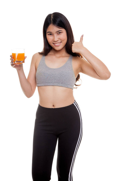Beautiful Asian healthy girl drinking  orange juice thumbs up. - Foto, immagini