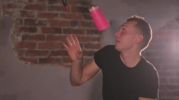 Bartender juggling bottles and shaking cocktail at a mobile bar - Video