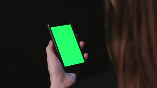 Woman is Holding Phone with green Screen Scroll - Footage, Video