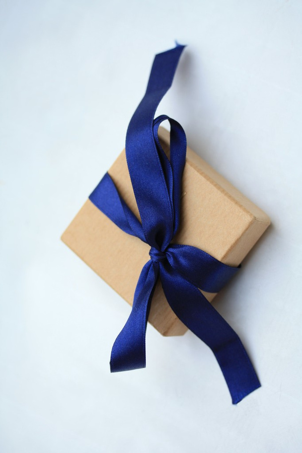 Giftbox with blue ribbon - Foto, Imagen