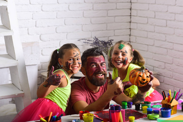 Halloween family with colorful paint. - Φωτογραφία, εικόνα