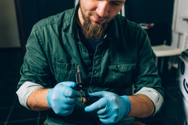 tattoo master artist prepares tools for tattooing - Photo, Image