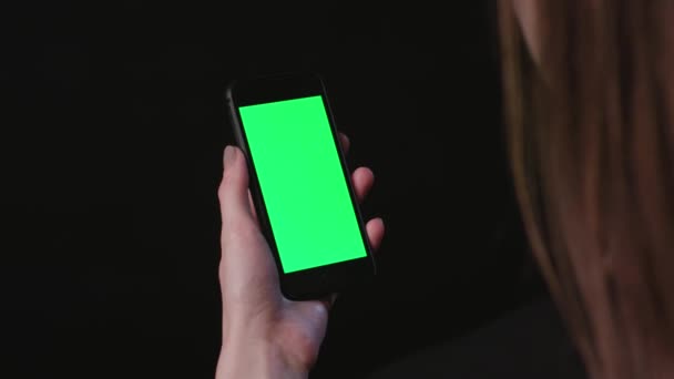 Woman is Holding Phone with green Screen Tap - Footage, Video