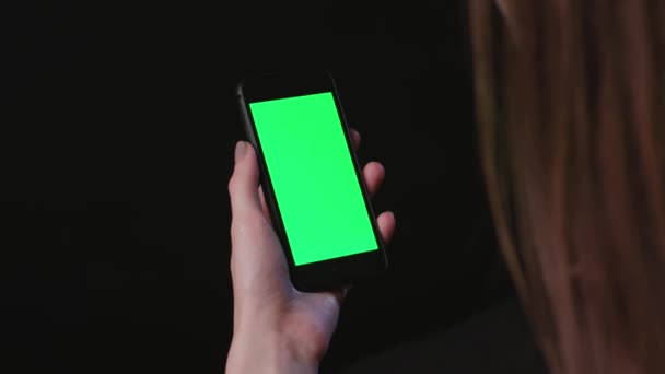 Woman is Holding Phone with green Screen Tap - Footage, Video