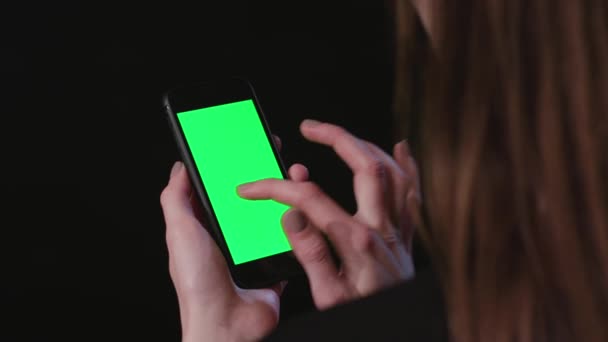 Woman is Holding Phone with green Screen Swipe - Footage, Video
