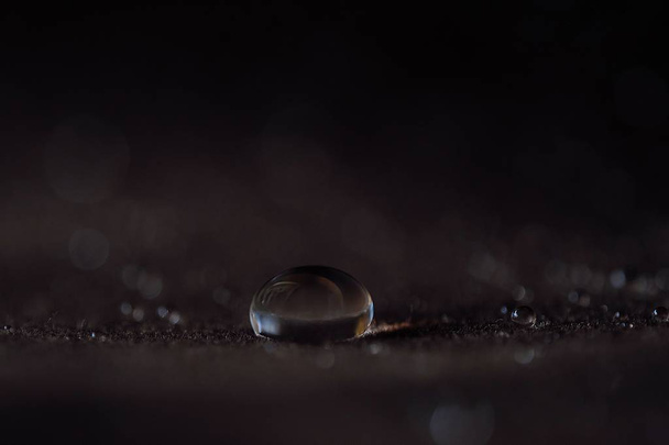 Beautiful water drops on a brown velvet - Foto, afbeelding