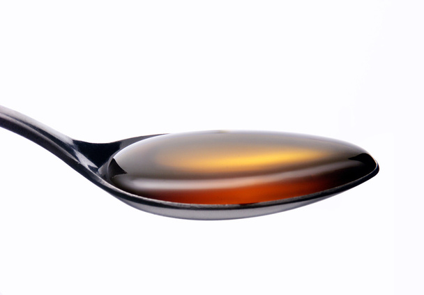 Honey on a teaspoon - Φωτογραφία, εικόνα