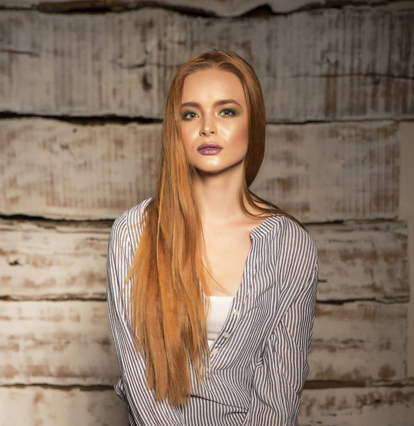 Portrait of a young long-haired ginger girl  - Fotoğraf, Görsel