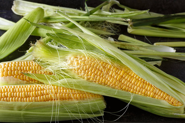 Fresh corn on black background - Фото, зображення
