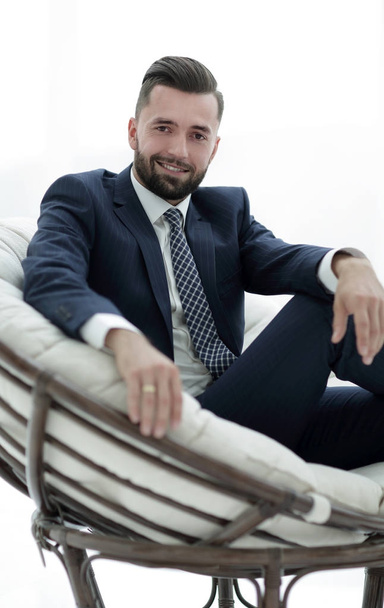 confident businessman sitting in a chair - Foto, afbeelding