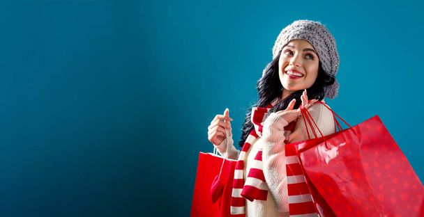 Happy young woman holding shopping bags  - Foto, immagini