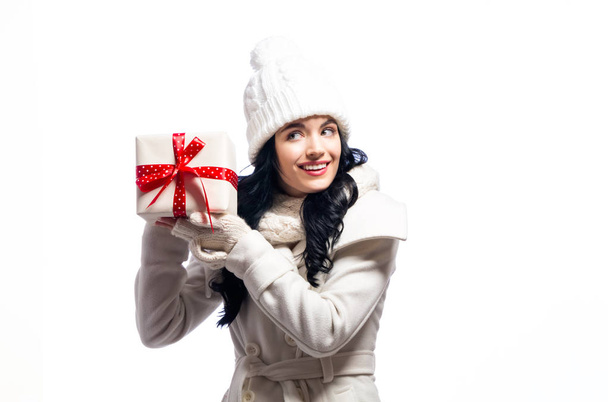 Young woman holding a Christmas gift - Valokuva, kuva