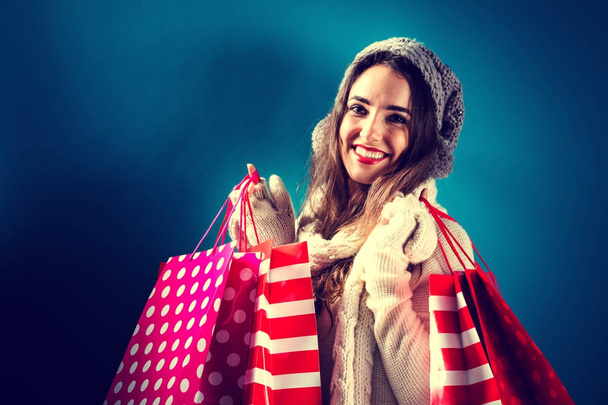 Happy young woman holding shopping bags - Φωτογραφία, εικόνα