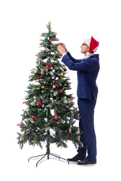 Businessman decorating christmas tree isolated on white - Foto, Bild