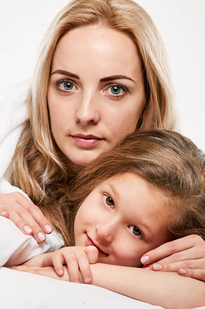 Mother and little daughter portrait close - Фото, изображение