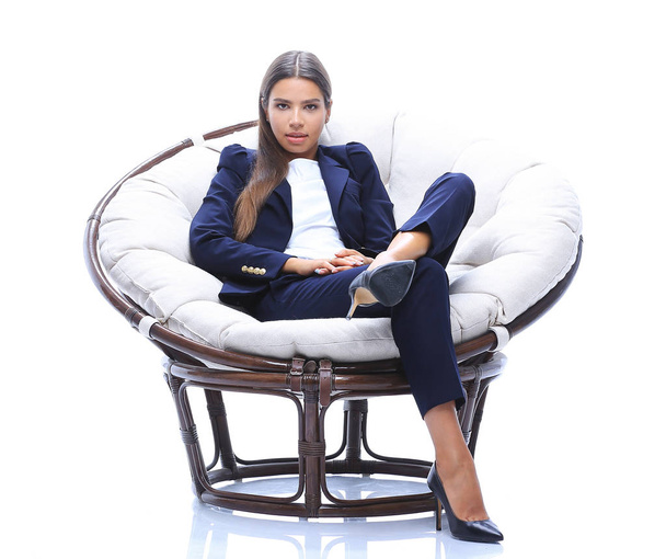 young business woman relaxes in a round chair - Foto, Imagem