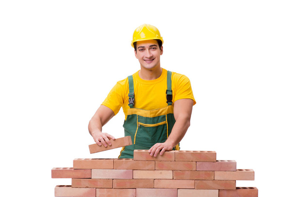 Ο όμορφος οικοδόμος χτίζει τοίχο από τούβλα - Φωτογραφία, εικόνα