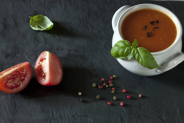 tomatoes soup in white bowl  - Fotó, kép