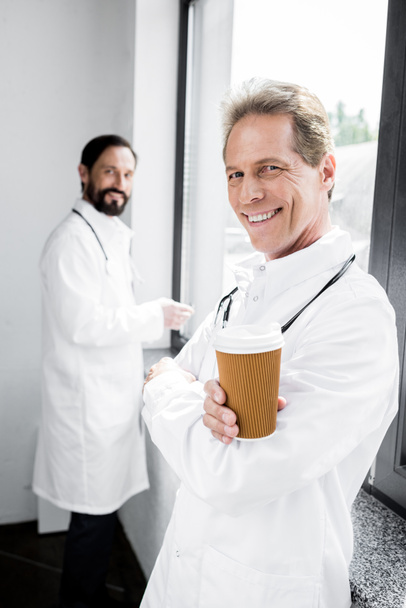 doctor drinking coffee to go - Photo, Image
