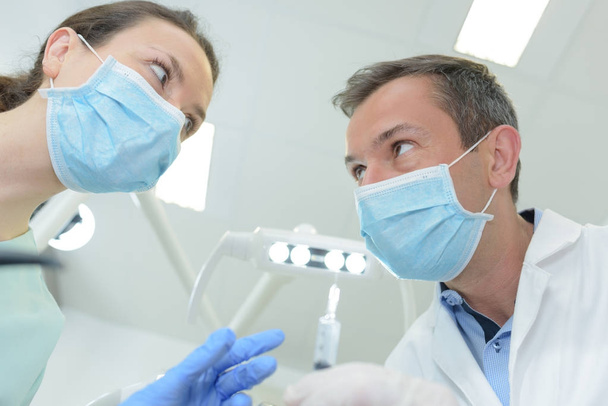 a male dentist and female dental nurse - Photo, image