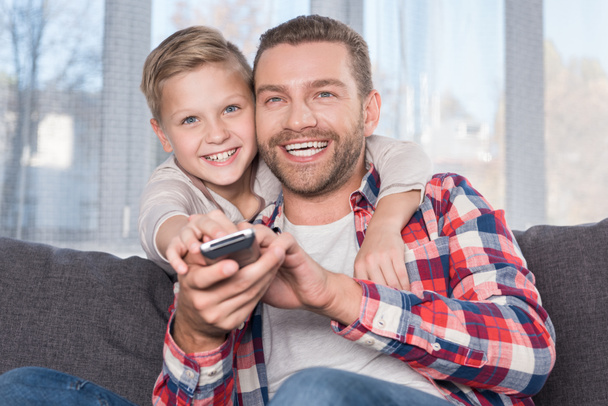 father and son watching tv  - Photo, Image