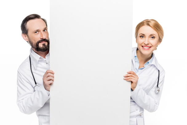 médicos con pancarta en blanco
 - Foto, Imagen