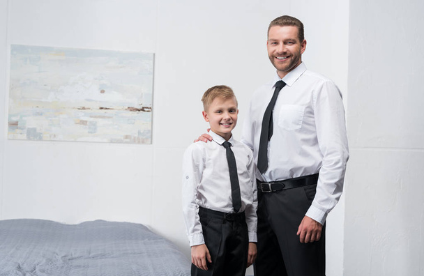 father and son in formal wear - 写真・画像