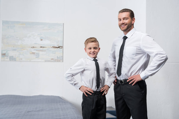 father and son in formal wear - Fotó, kép
