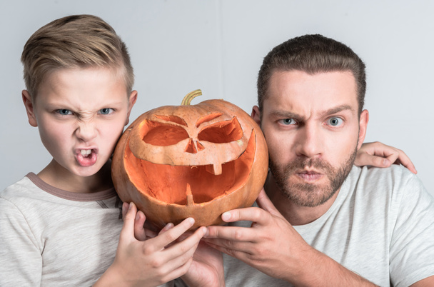 father and son with halloween pumpkin - Photo, Image