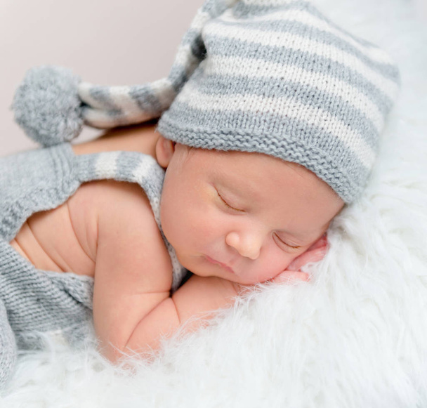 Adorable newborn boy sweetly sleeping, close-up. - Zdjęcie, obraz