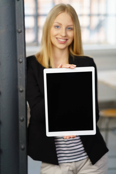 Young smiling woman holding digital tablet - Fotografie, Obrázek
